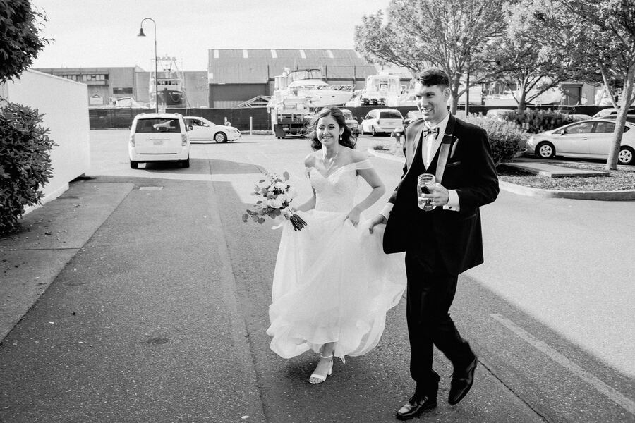 Black and white couple walking through downtown