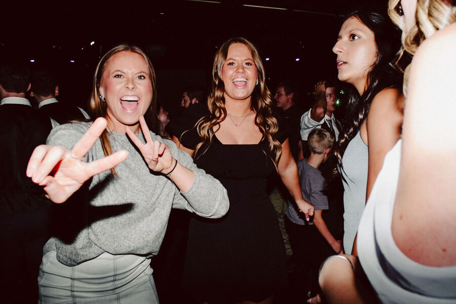 Friends laughing on the dance floor